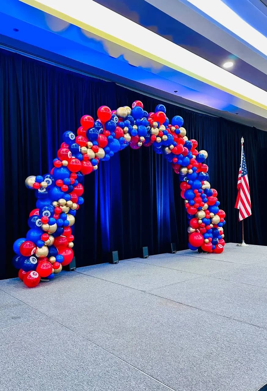 Stage balloon arch and helium bouquets produced by Balloon Décor for a corporate client in San Francisco Peninsula, view 3.