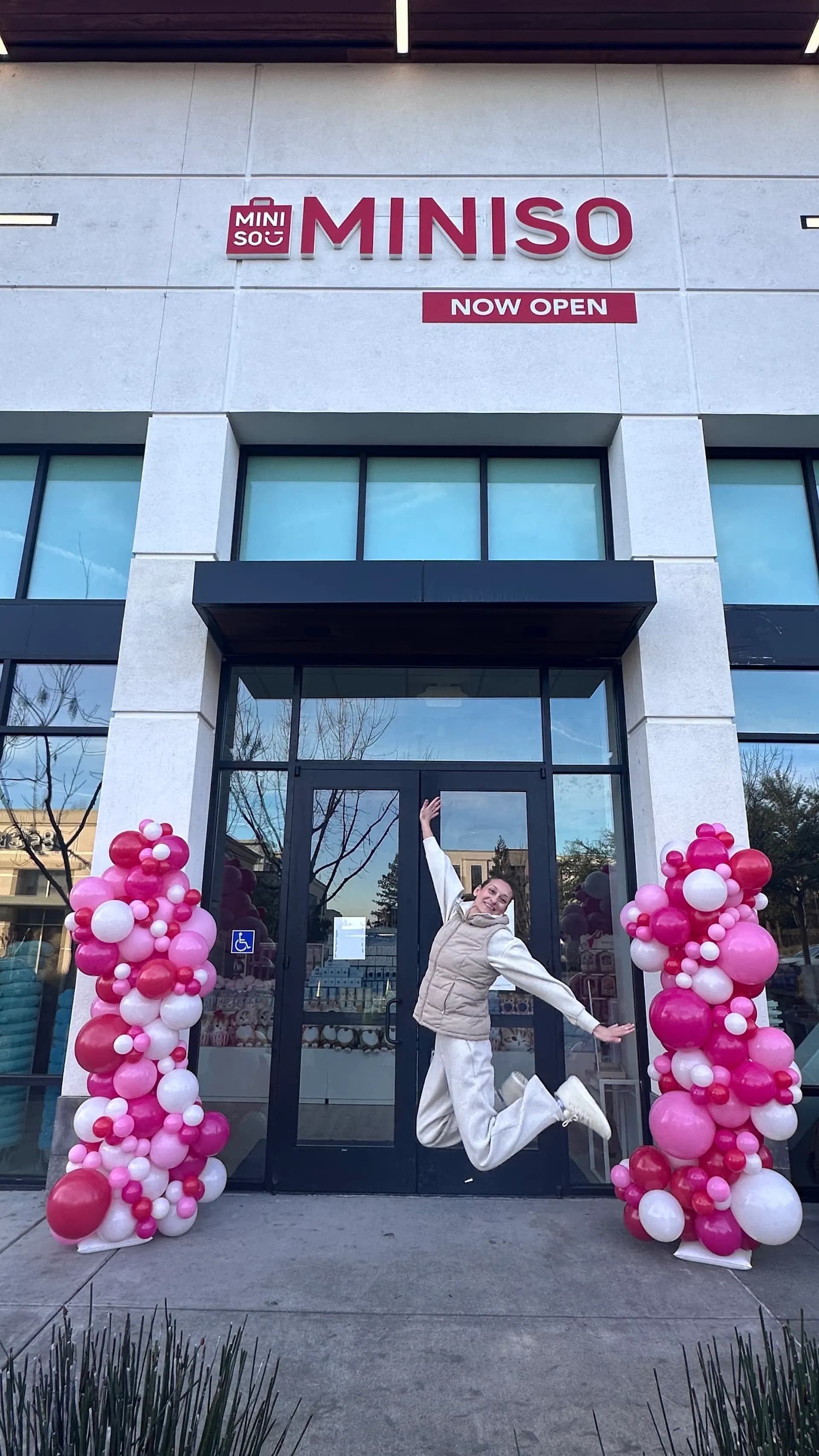 MINISO's Store Grand Opening in San Francisco Bay Area: branded entrance balloon columns, view 2 of 5.