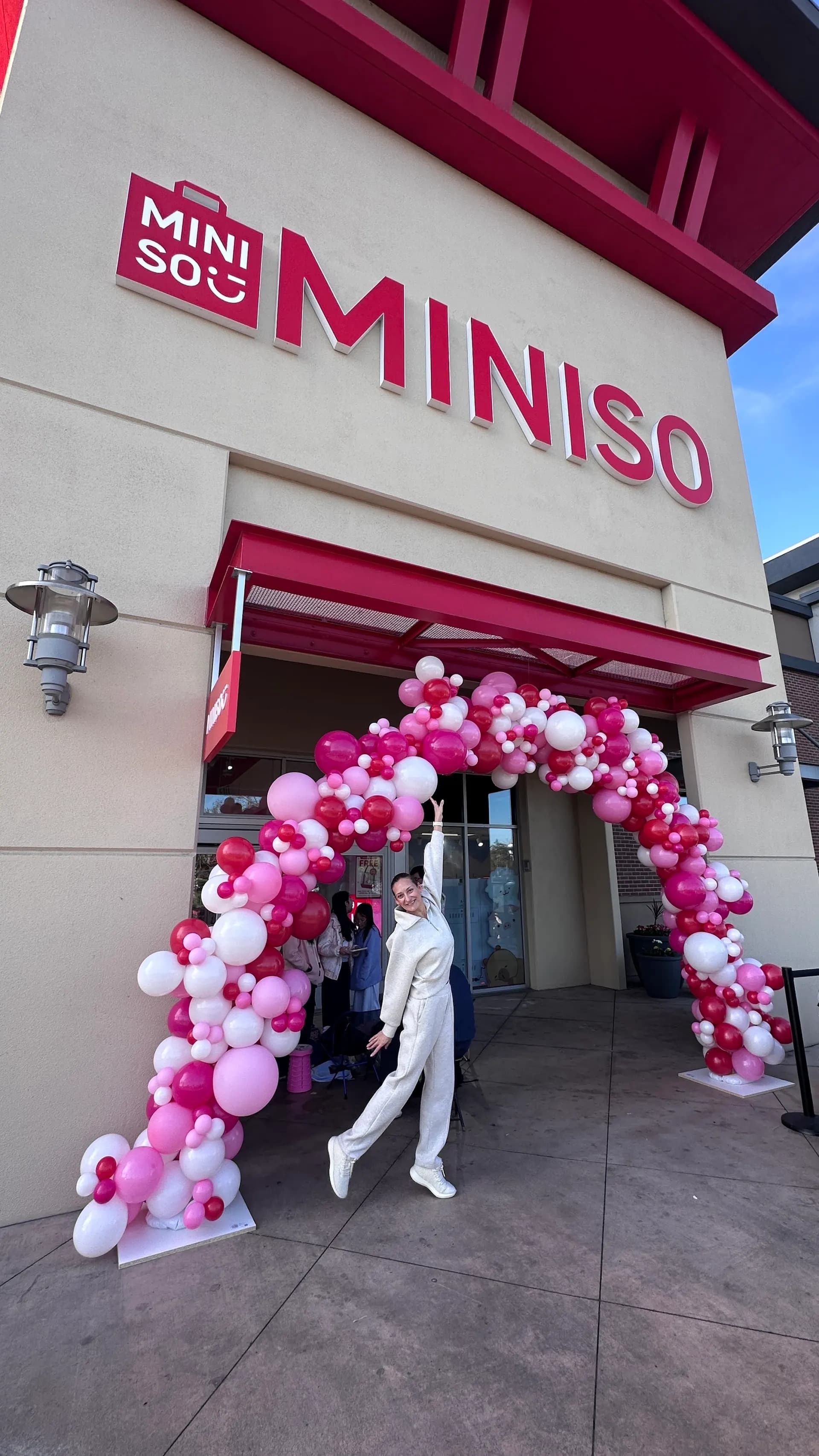 Branded entrance balloon columns produced by Balloon Décor for MINISO in San Francisco Bay Area, view 3.