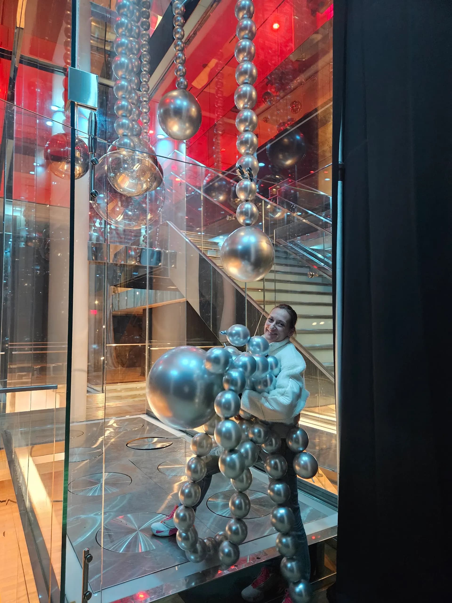 Modern Corporate Event in San Francisco, California: hanging silver balloon sphere installation, view 2 of 4.