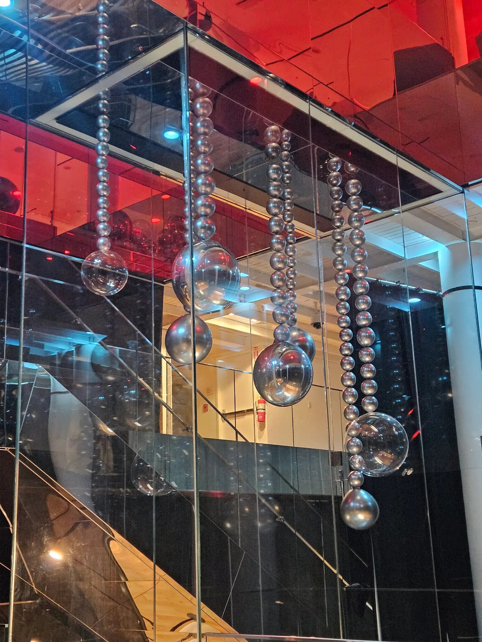 Completed hanging silver balloon sphere installation from the Modern Corporate Event project in San Francisco, California (image 4 of 4).