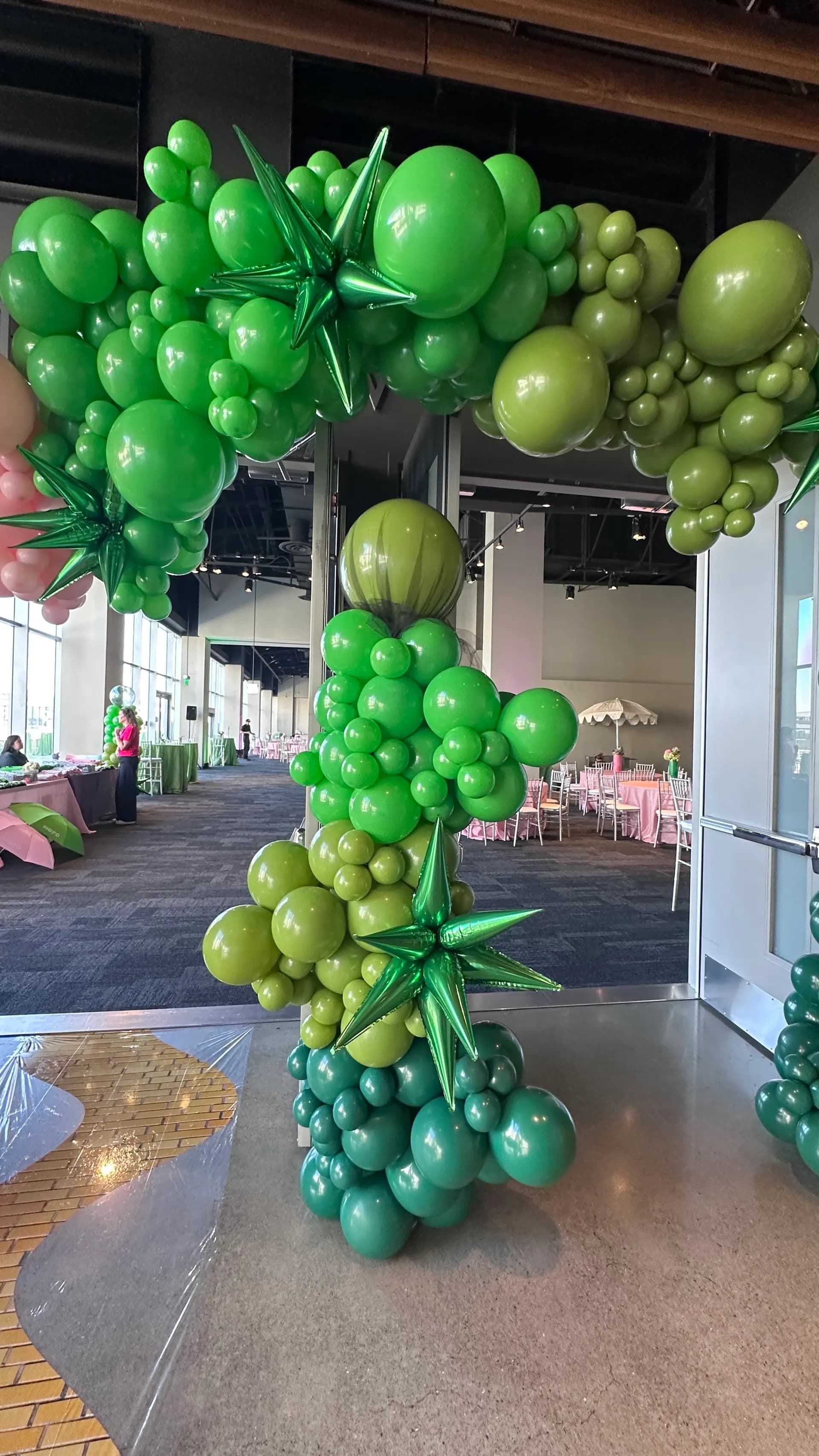 Themed Corporate Event in San Francisco, California: emerald City and Glinda themed arches and centerpieces, view 2 of 8.