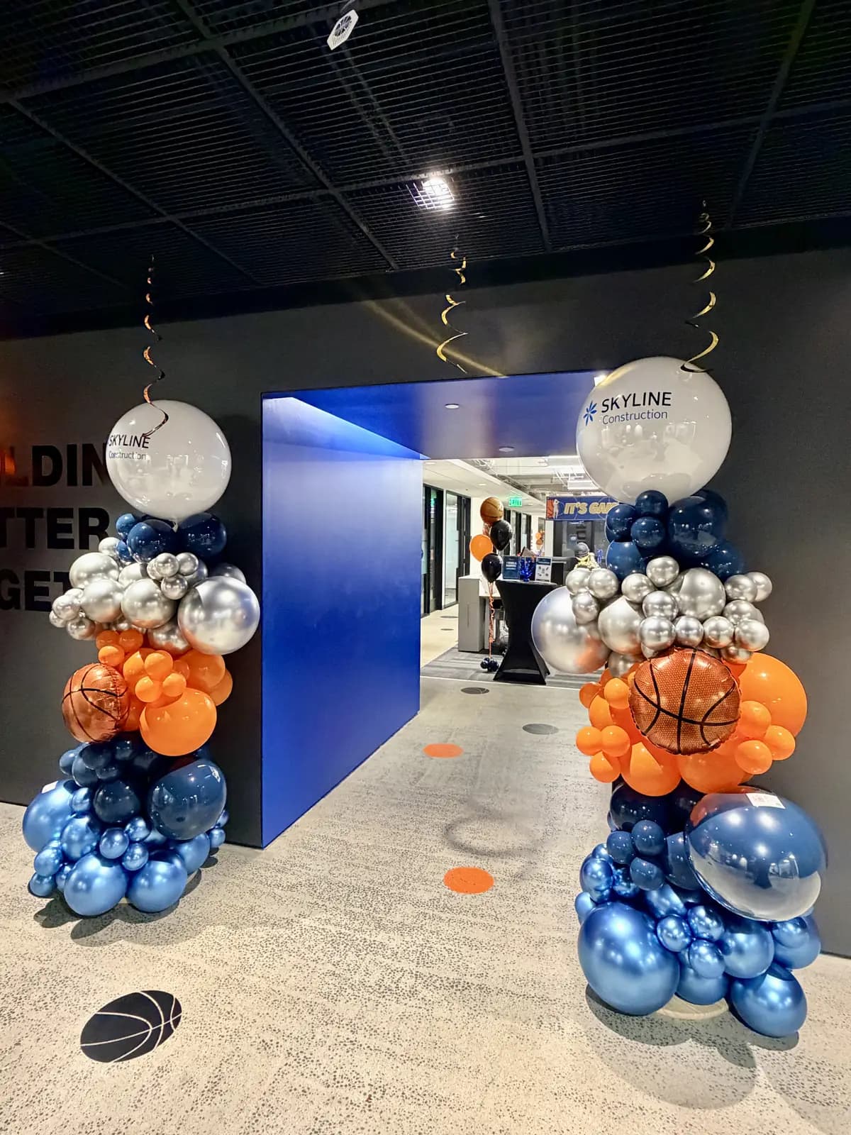 Skyline Construction March Madness Balloon Columns — view 01