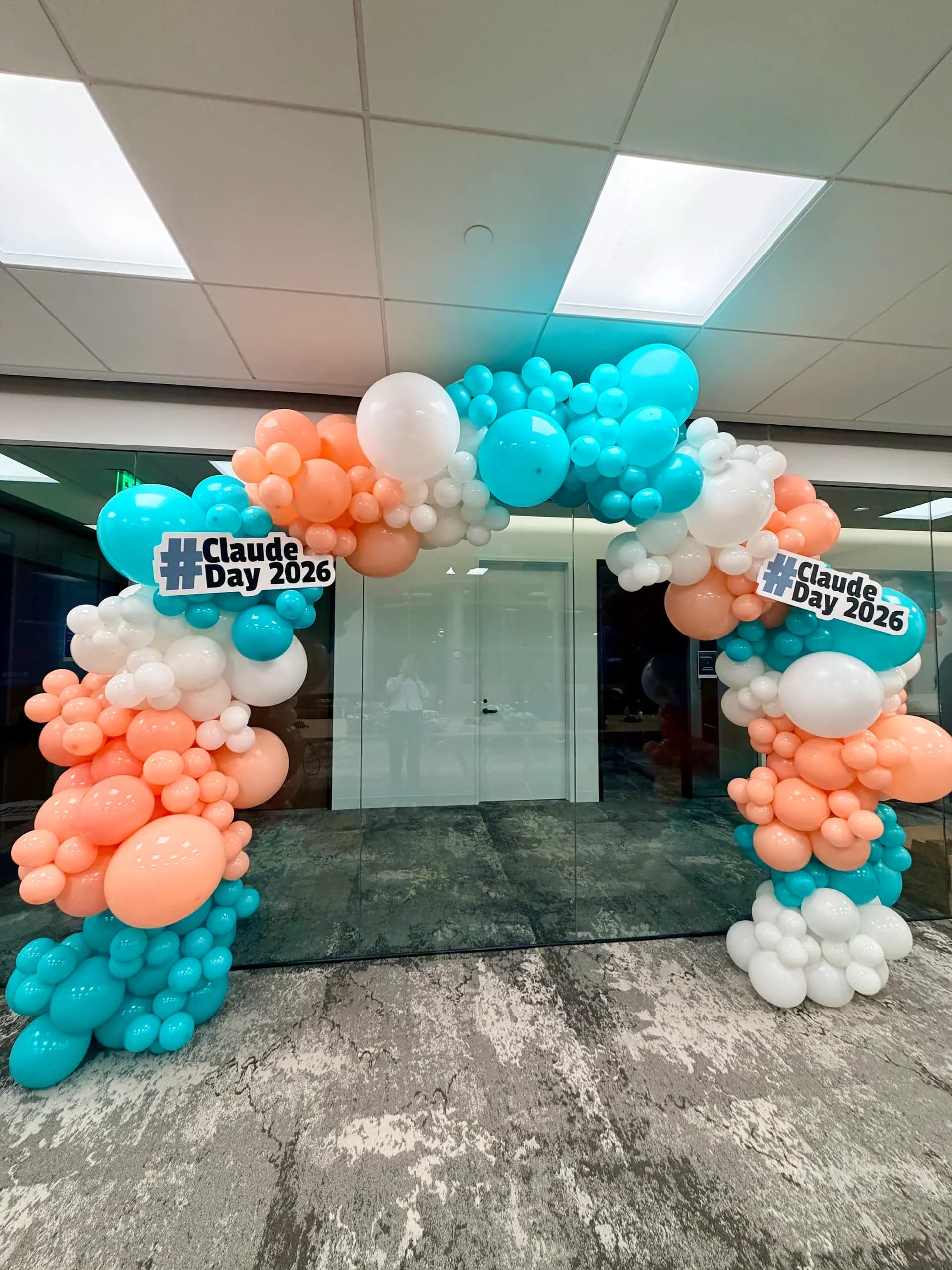 Branded organic balloon arch at the AI Industry Corporate Event in San Francisco Bay Area.