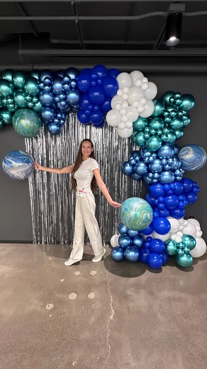 AWS's Tech Summit 2025 in San Francisco, California: metallic organic balloon backdrop, view 2 of 5.