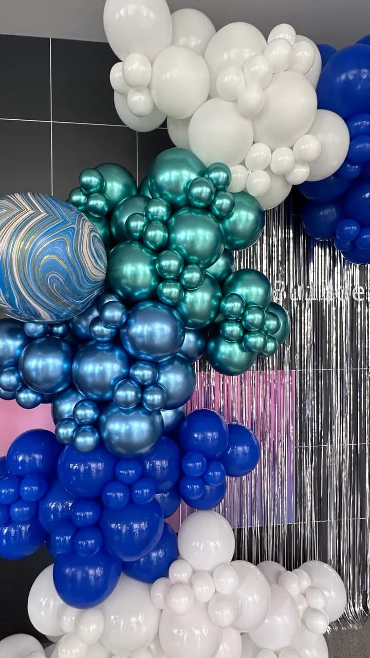 Metallic organic balloon backdrop installed on site for the Tech Summit 2025 in San Francisco, California, frame 5 of 5.