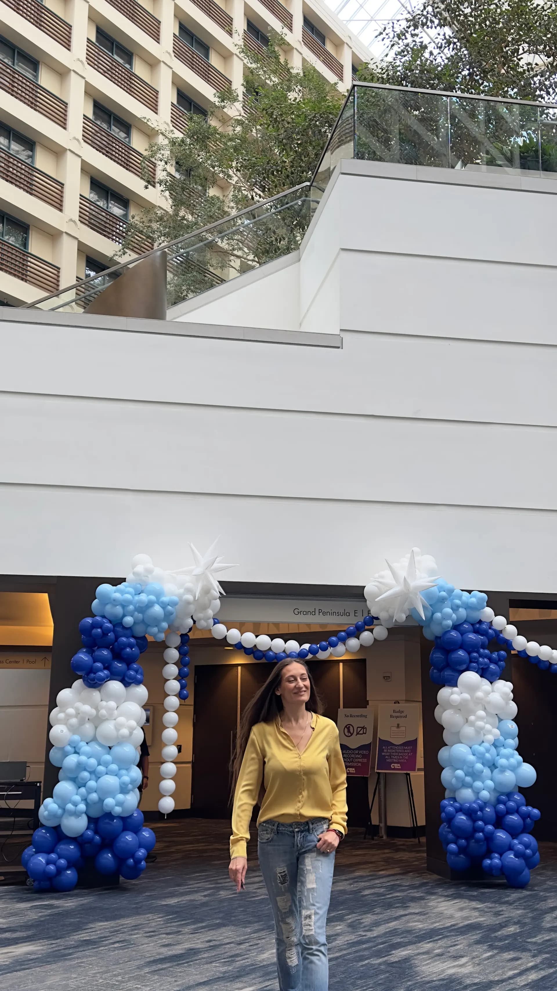 Blue-and-white entrance balloon arches at the Conference Event in Hyatt Regency San Francisco Airport.