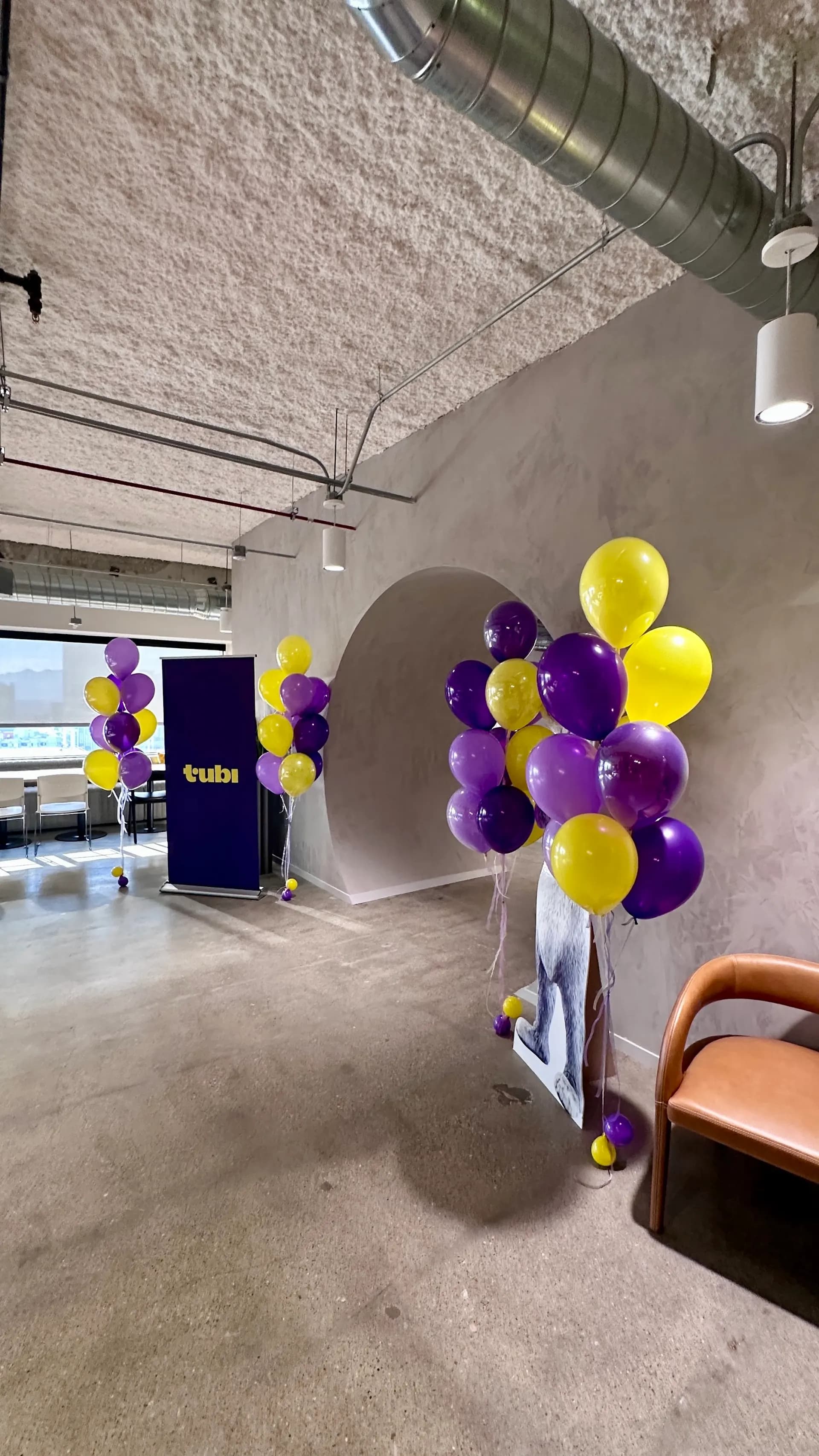 Helium balloon décor in brand colors at the Corporate Office Event in SoMa, San Francisco.