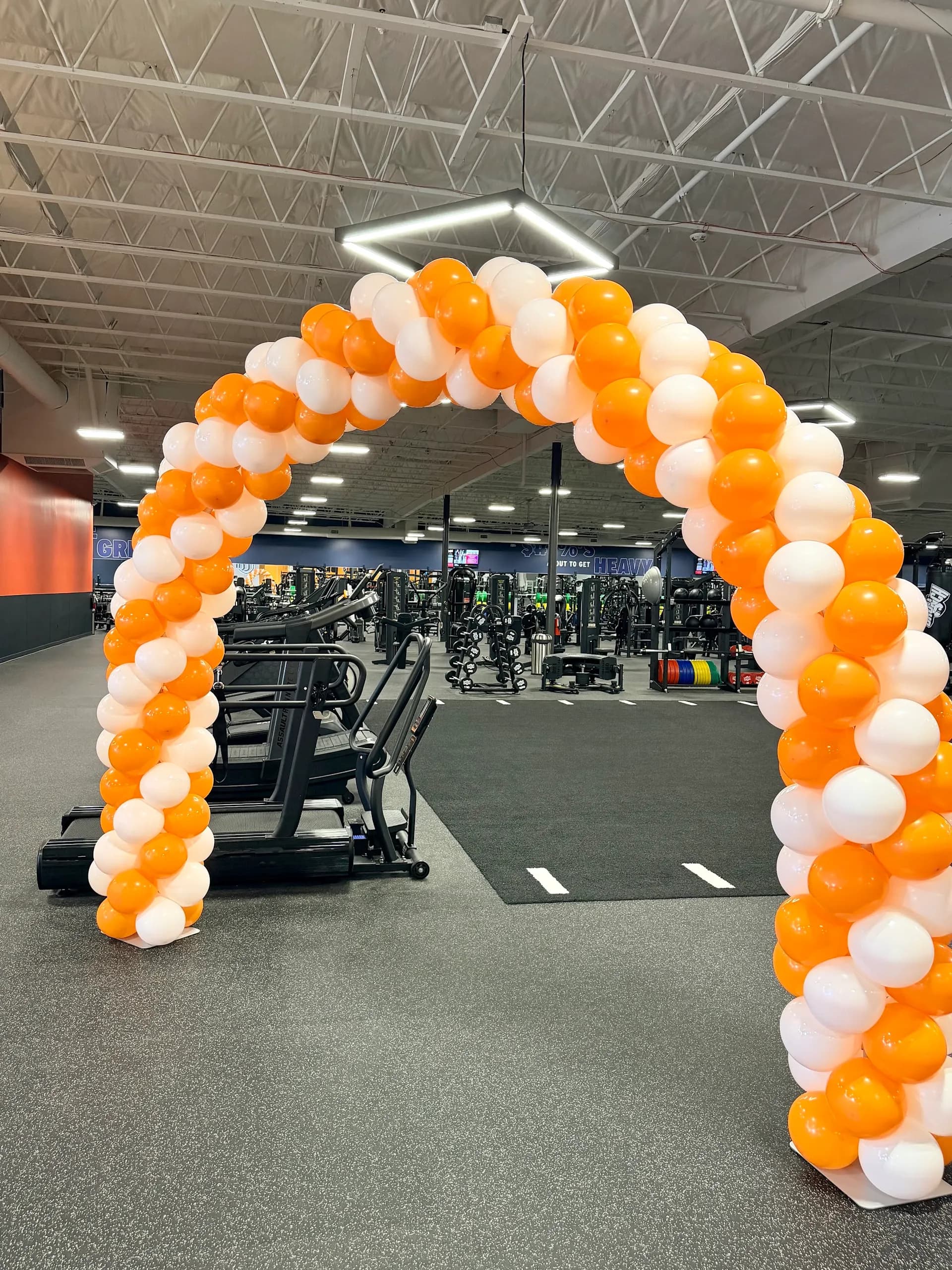 Balloon arch and entrance columns produced by Balloon Décor for Crunch Fitness in Gilroy, California, view 3.