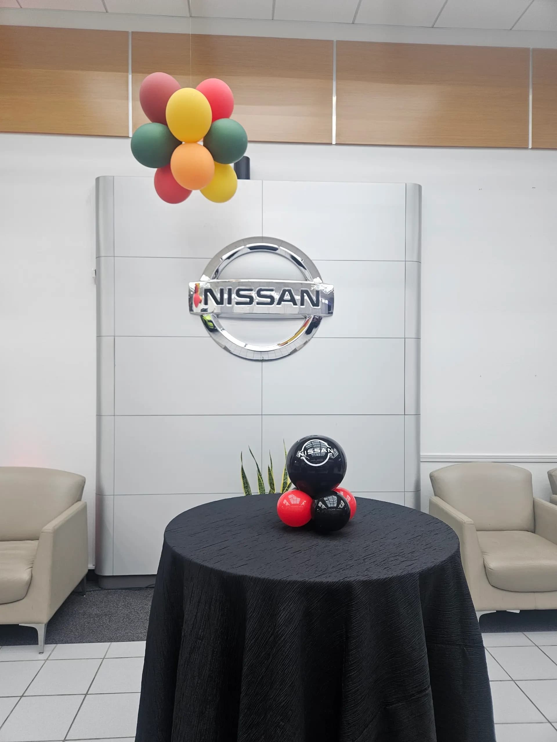 Showroom décor and branded centerpieces for Nissan at the Dealership Grand Opening in San Francisco Bay Area.