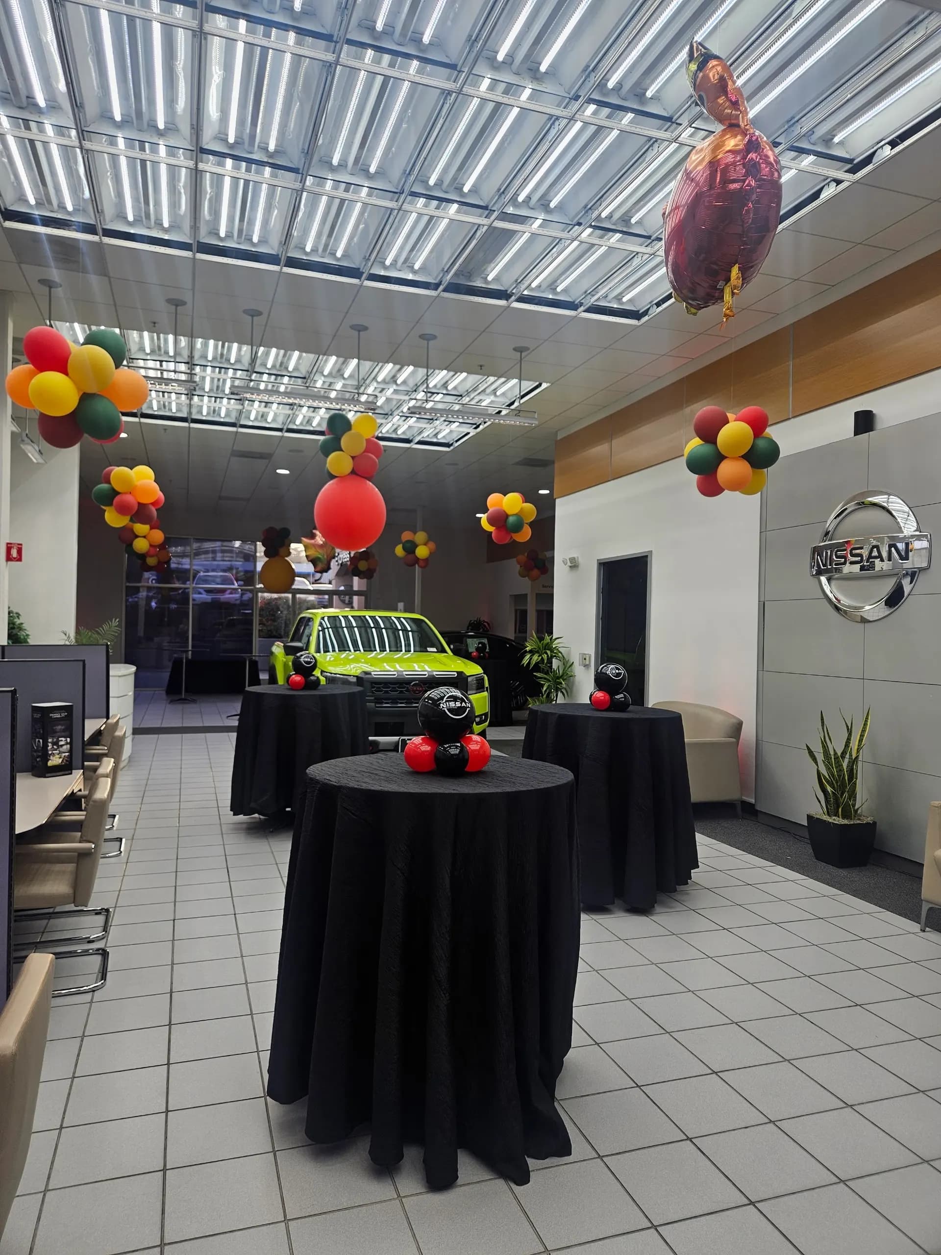 Showroom décor and branded centerpieces produced by Balloon Décor for Nissan in San Francisco Bay Area, view 3.