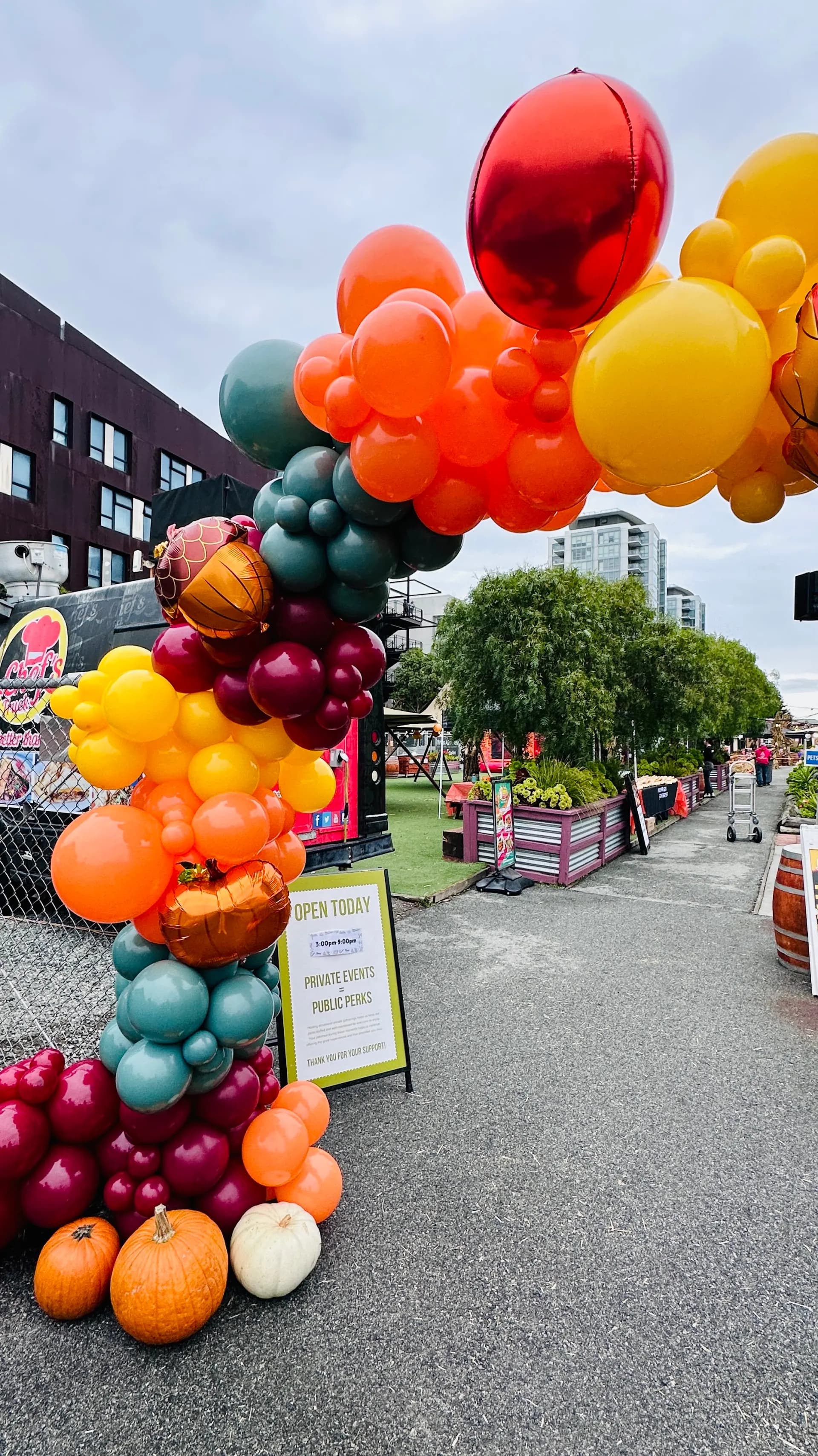 Outdoor organic balloon arch with pumpkins at the Fall Corporate Event in San Francisco Bay Area.