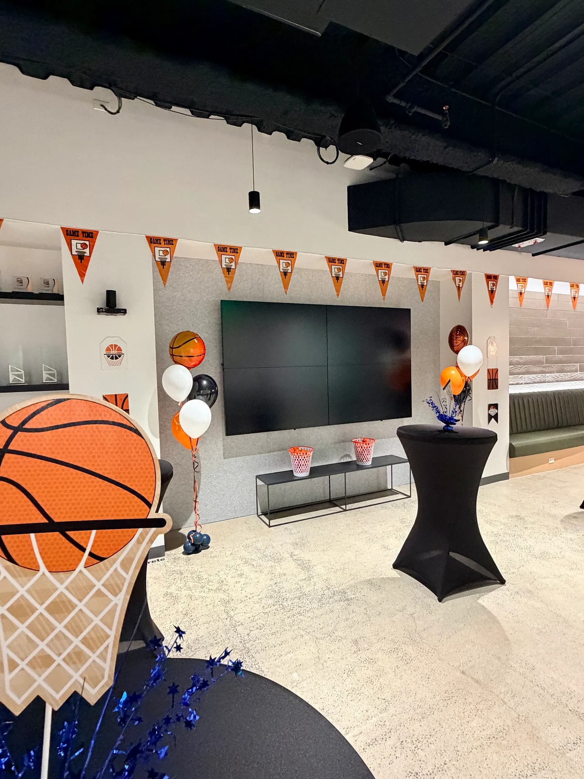 Completed basketball-themed garland and branded columns from the March Madness Office Event project in San Francisco Bay Area (image 4 of 6).