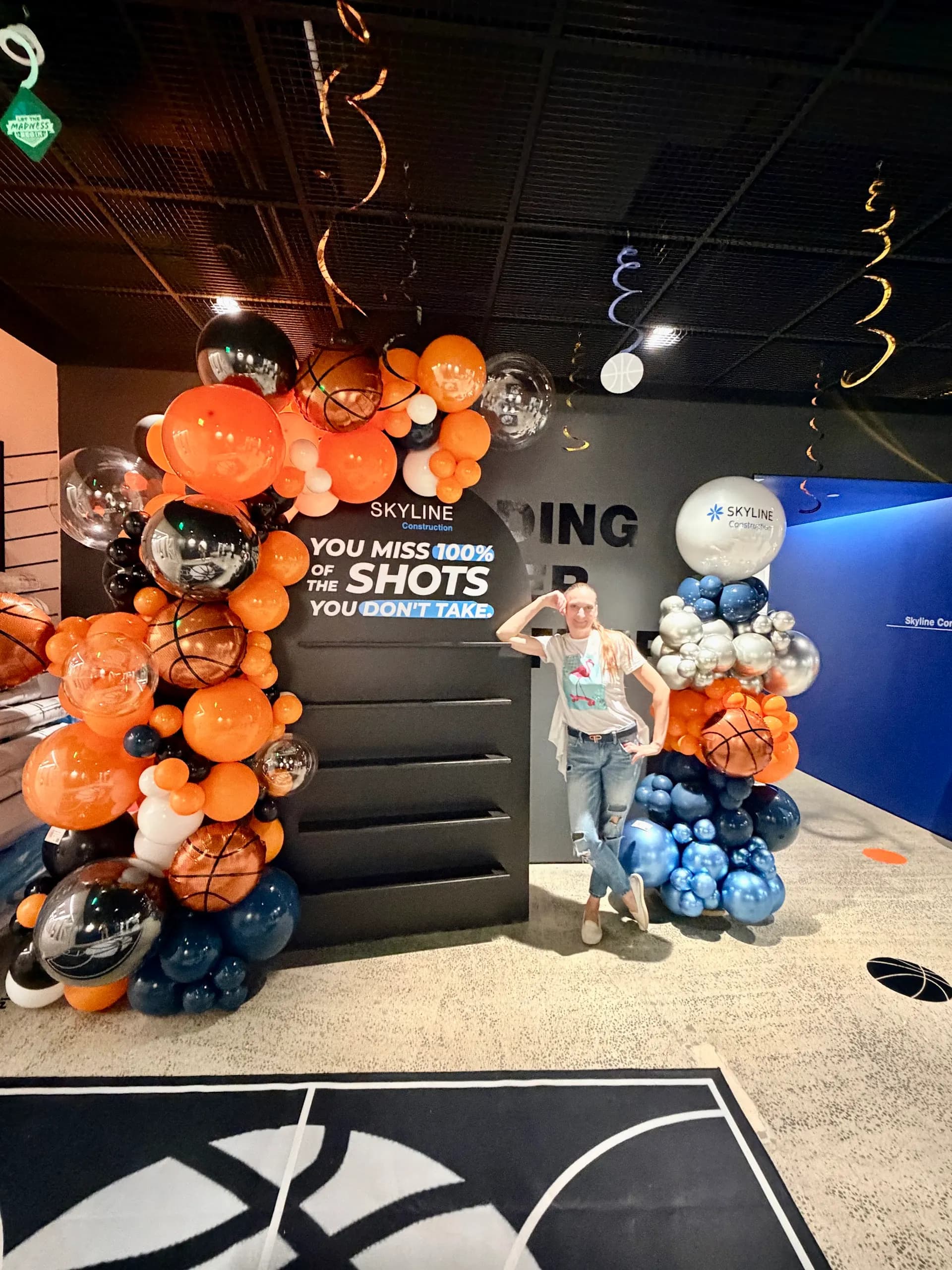 Basketball-themed garland and branded columns installed on site for the March Madness Office Event in San Francisco Bay Area, frame 5 of 6.